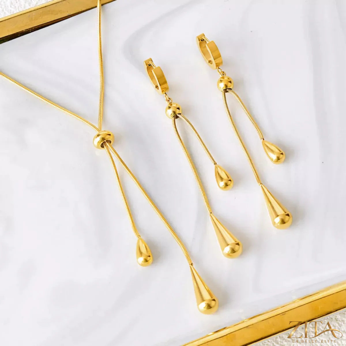Trendsi teardrop pendant necklace and matching earrings jewelry set with silver-tone finish and elegant teardrop designs.