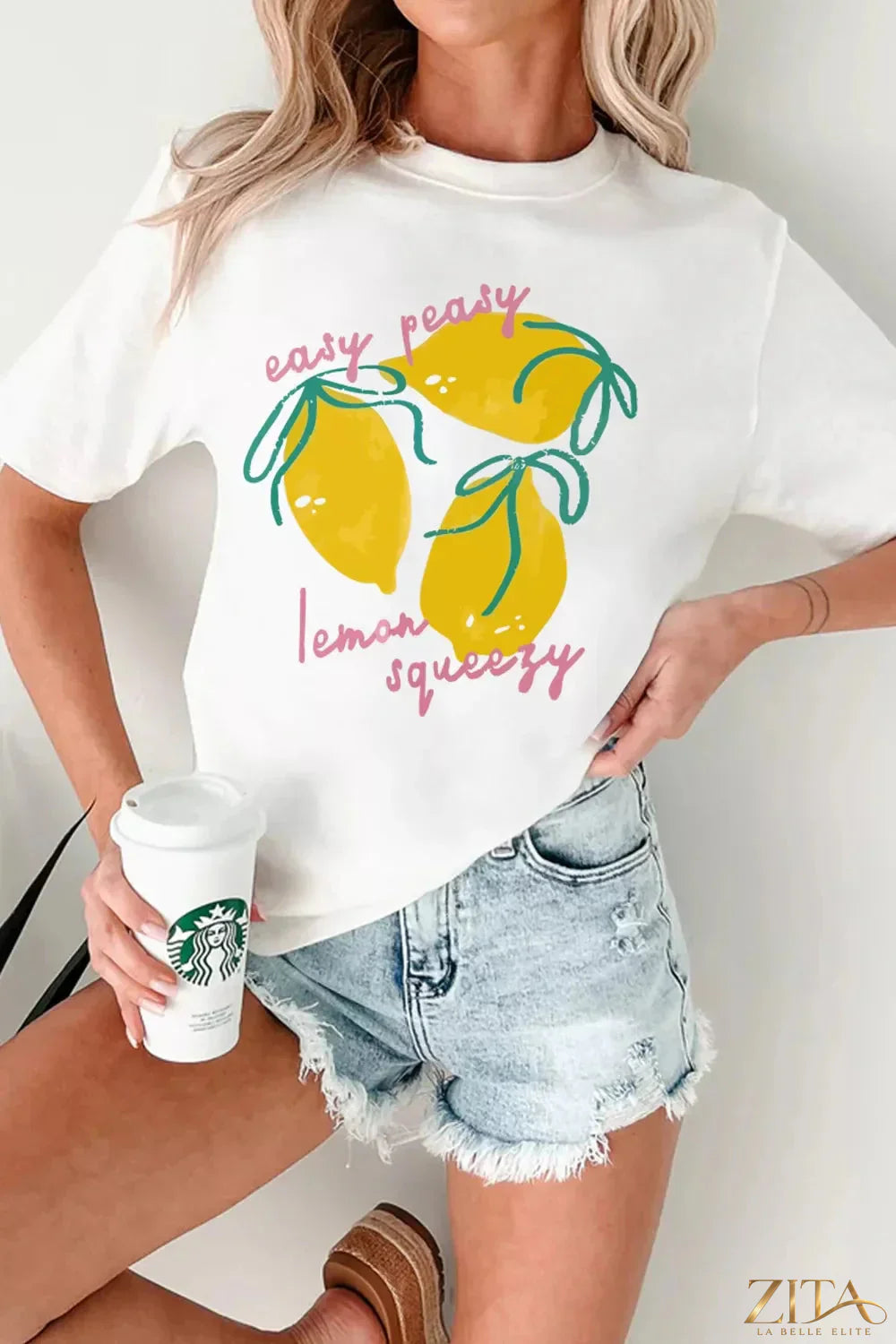 Easy Peasy Lemon Squeezy graphic T-shirt by Trendsi featuring a bright lemon design on a casual cotton tee