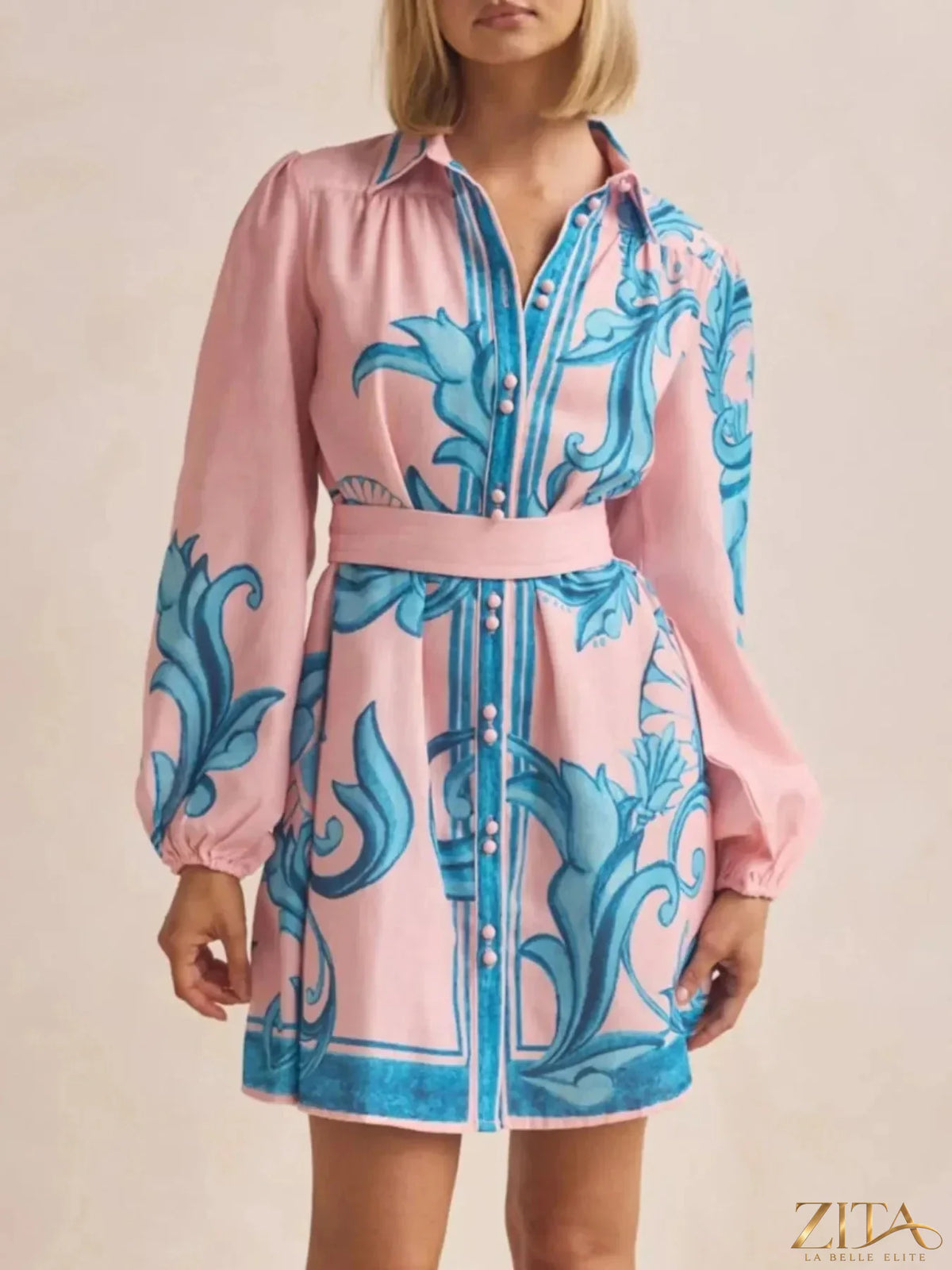 Printed long sleeve shirt dress by Trendsi featuring a stylish design and button-front detail, perfect for casual or dressy occasions.