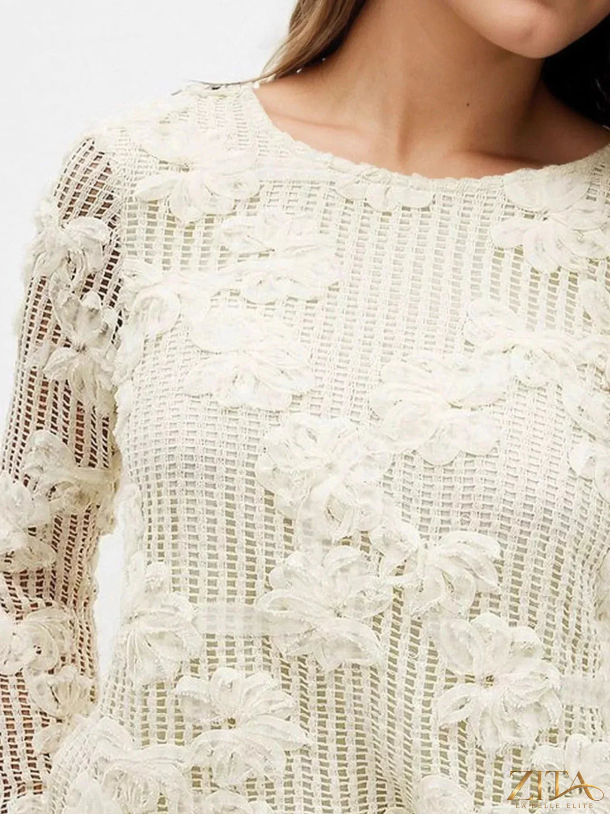 Zita La Belle Elite openwork tied-back long sleeve blouse with intricate lace details and a relaxed fit, shown on a model.