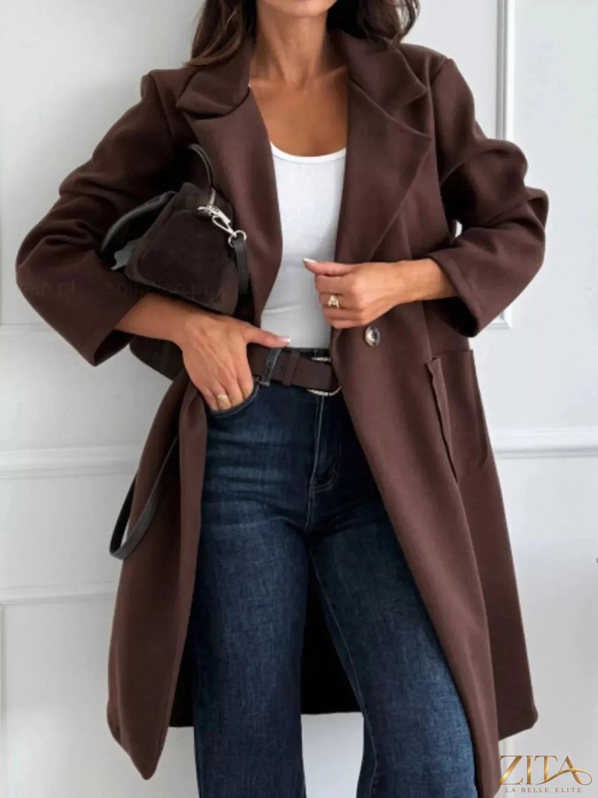 Zita La Belle Elite long-sleeve single-breasted trench coat in classic beige, displayed on a hanger against a neutral background.