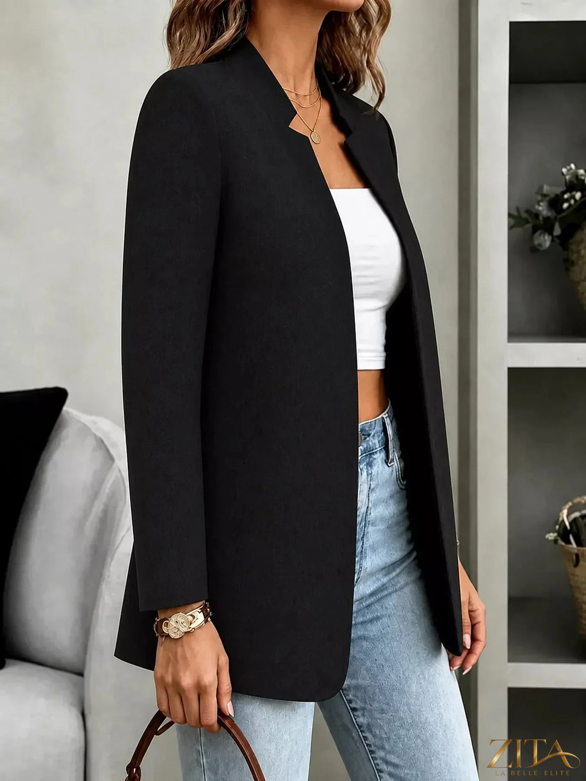 Open-front long sleeve blazer by Trendsi featuring a tailored fit and classic design, shown in a neutral color.