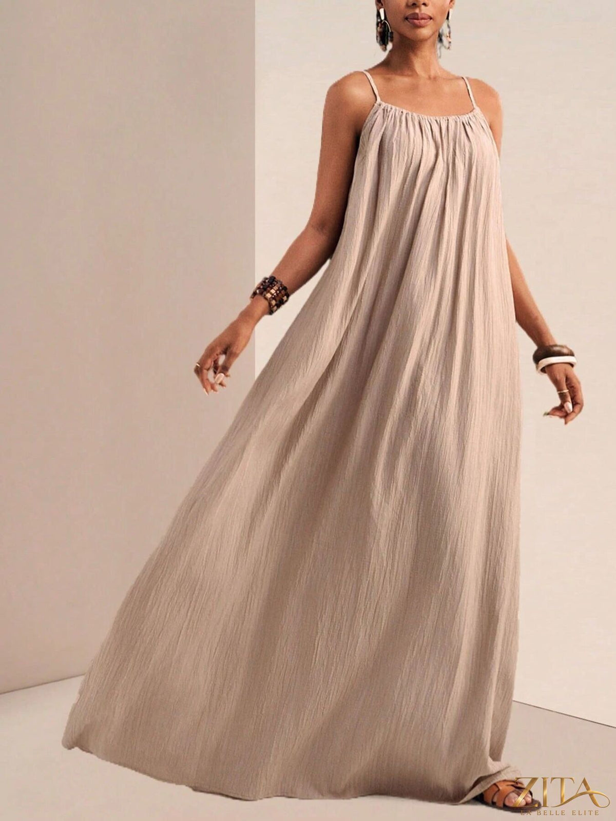 Flowy maxi dress with spaghetti straps by Zita La Belle Elite, featuring a relaxed fit and elegant drape.