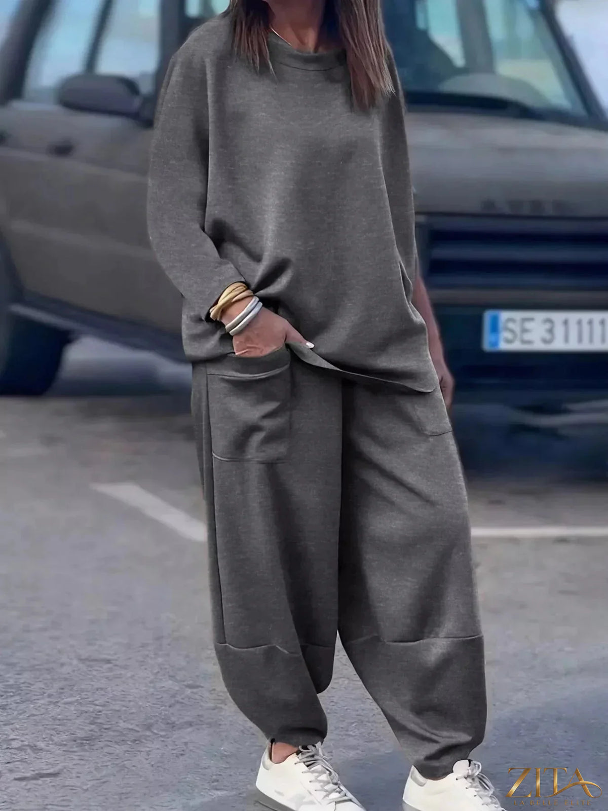 Plus size casual loose fit top and pants two-piece set from Trendsi, with comfortable, relaxed-fit fabric in a stylish design.