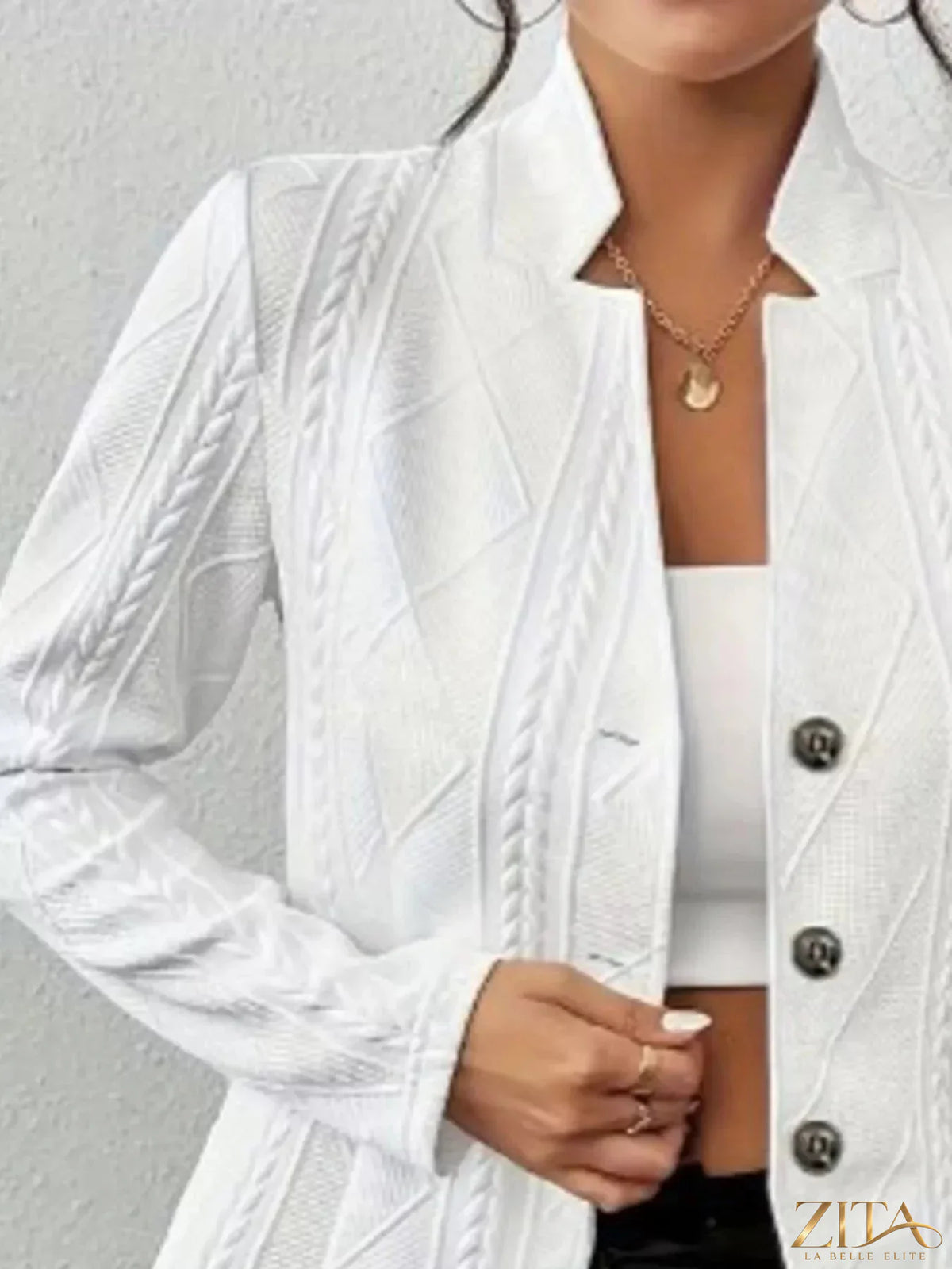 Zita La Belle Elite textured knit button-front blazer displayed on a hanger, showcasing its tailored fit and stylish design.