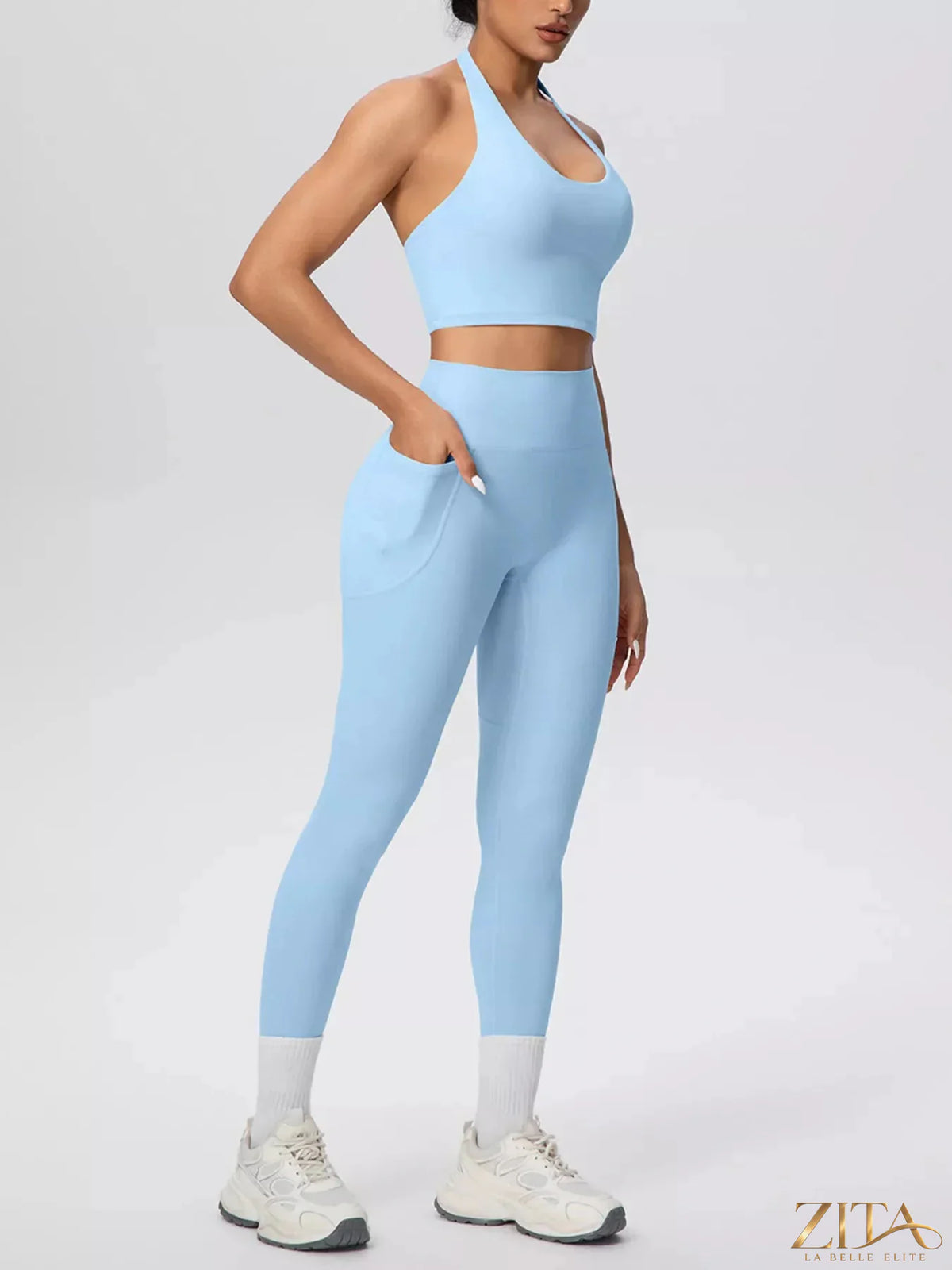 Zita La Belle Elite halter neck crop top and high-waisted leggings active set, black, made from stretchy athletic fabric.