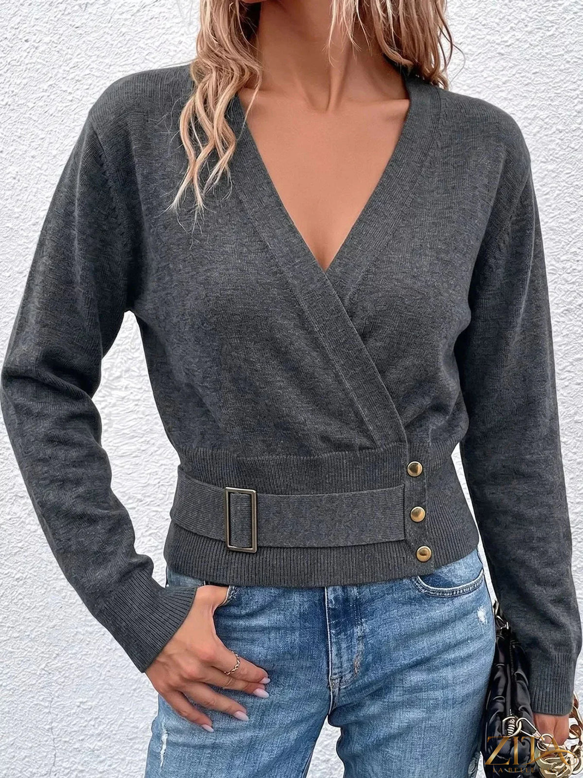 Zita La Belle Elite surplice long sleeve knit top with elastic waist, featuring a fitted design and soft fabric in a neutral color.
