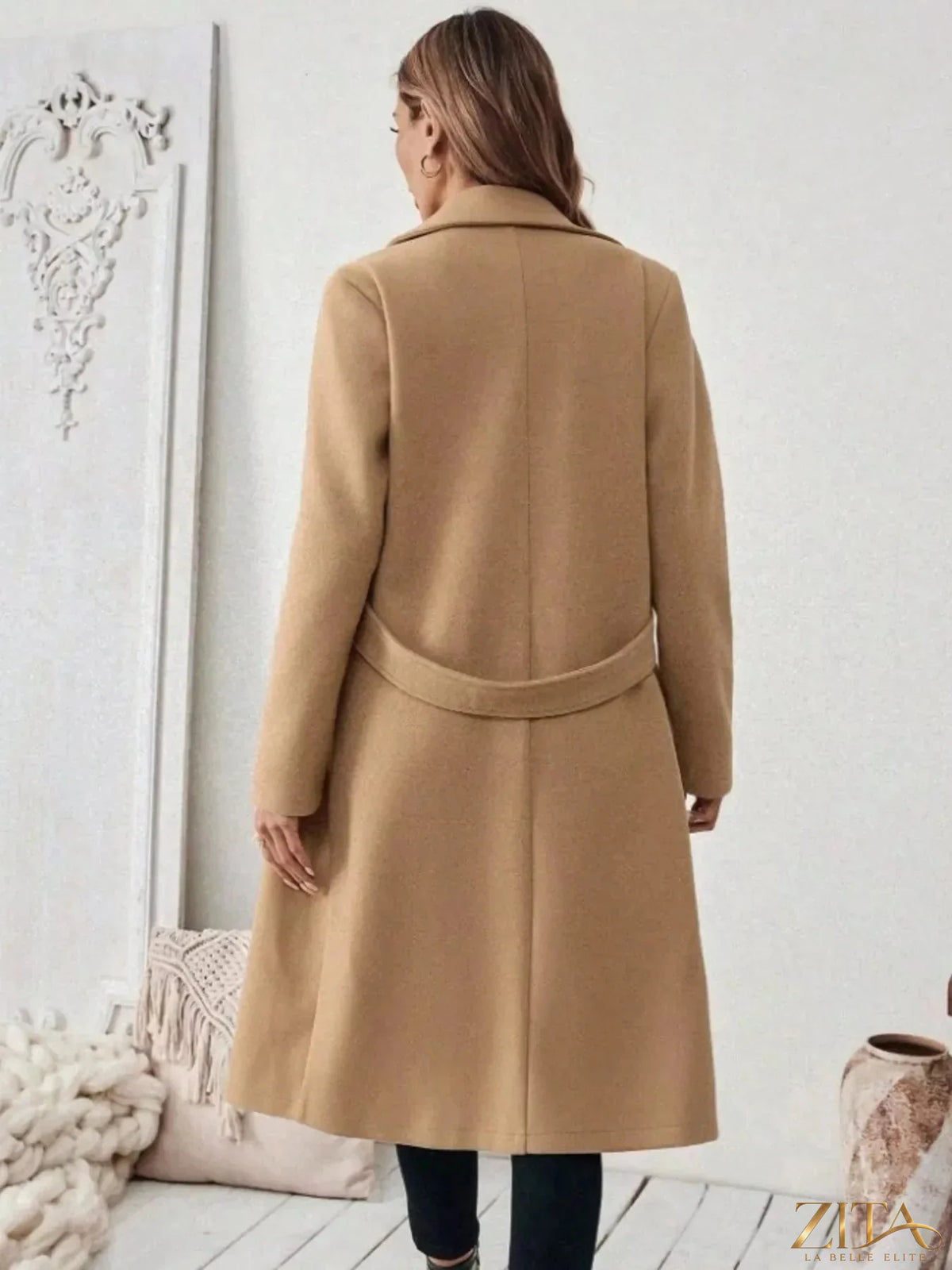 Plus size Zita La Belle Elite elegant coat with lapel collar, belted waist, and pockets, showcasing a full-length design.