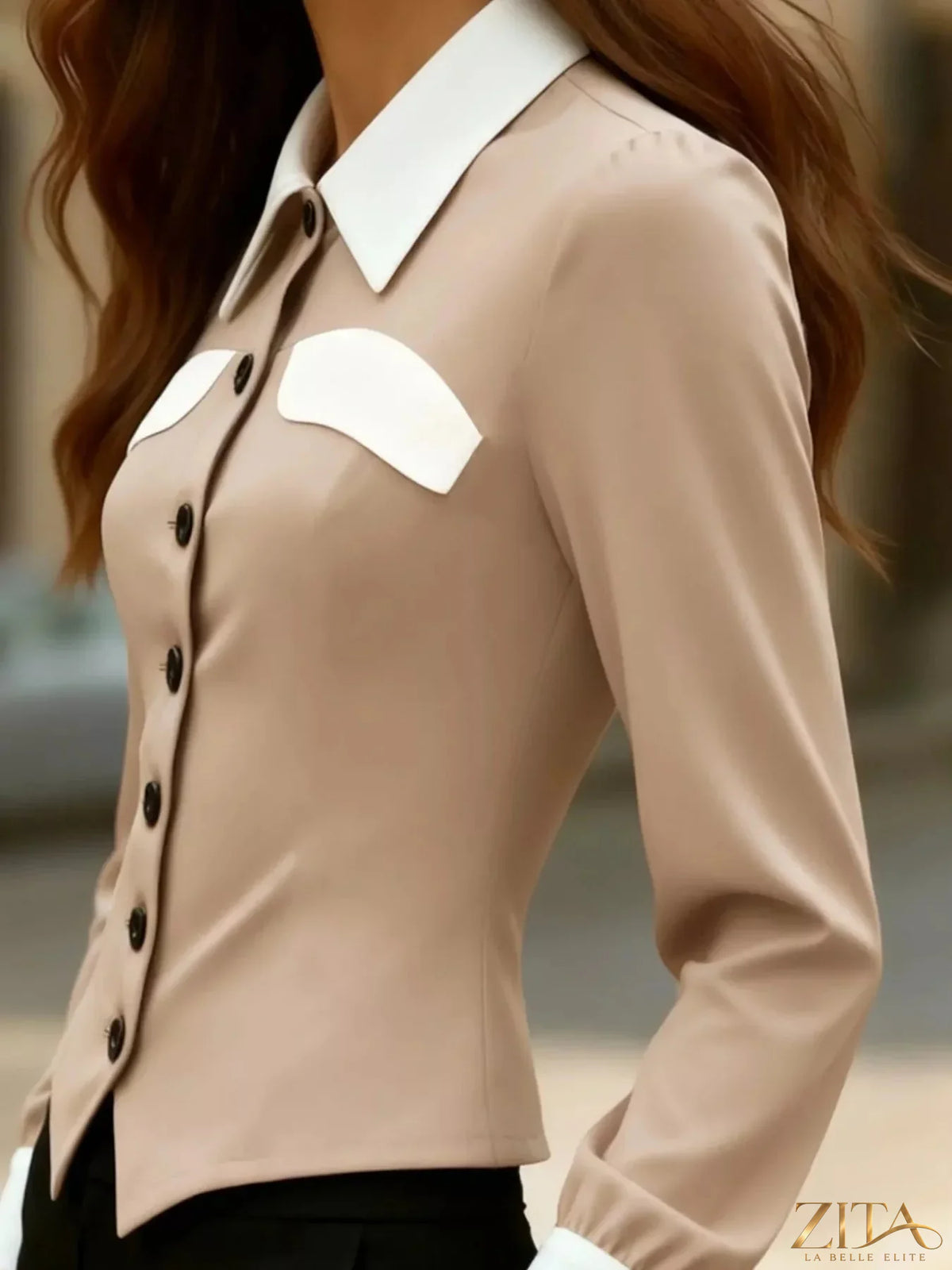 Zita La Belle Elite contrast button-down shirt with black and white pattern, long sleeves, and collar, hanging on a wooden hanger.