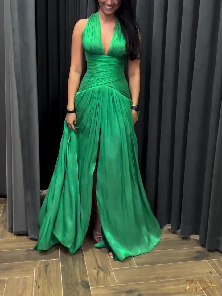 Emerald green plunging neckline gown with pleated skirt and side slit by Zita La Belle Elite, elegant formal dress design.