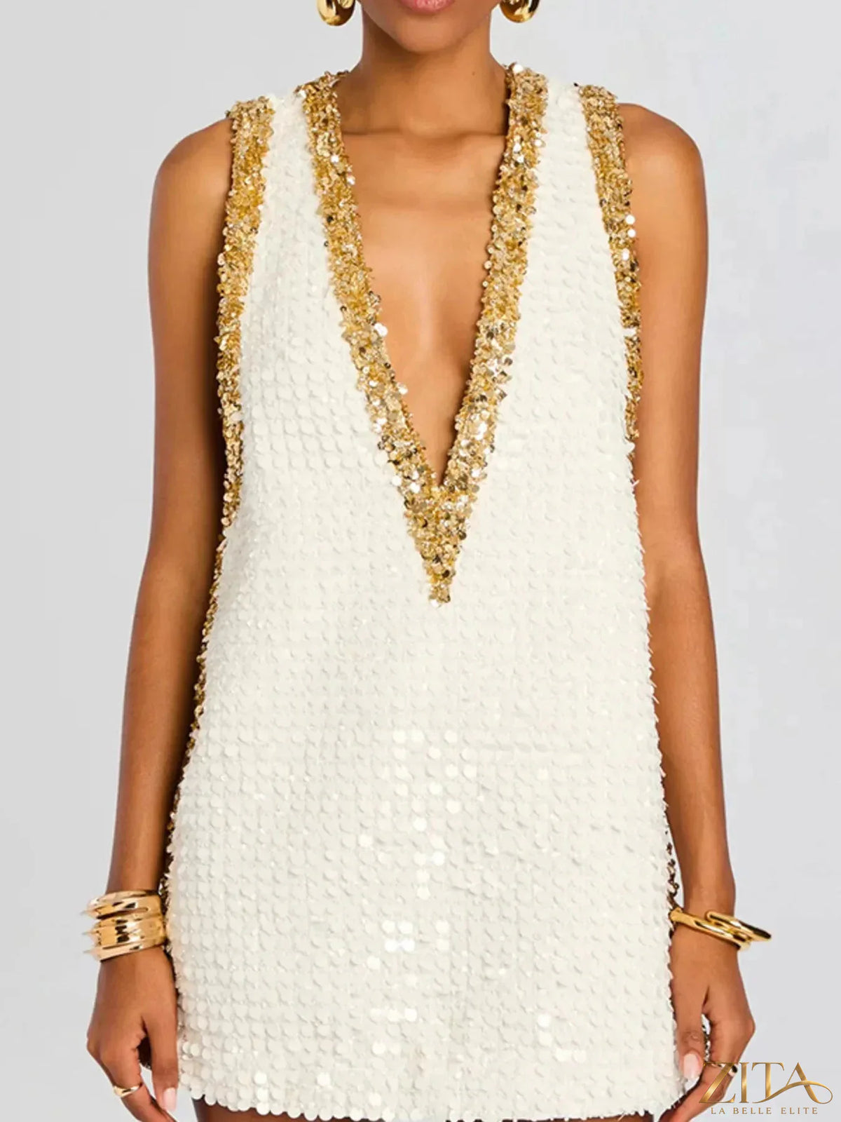Sequin embellished sleeveless mini dress by Zita La Belle Elite, featuring a fitted silhouette and shimmering sequins.