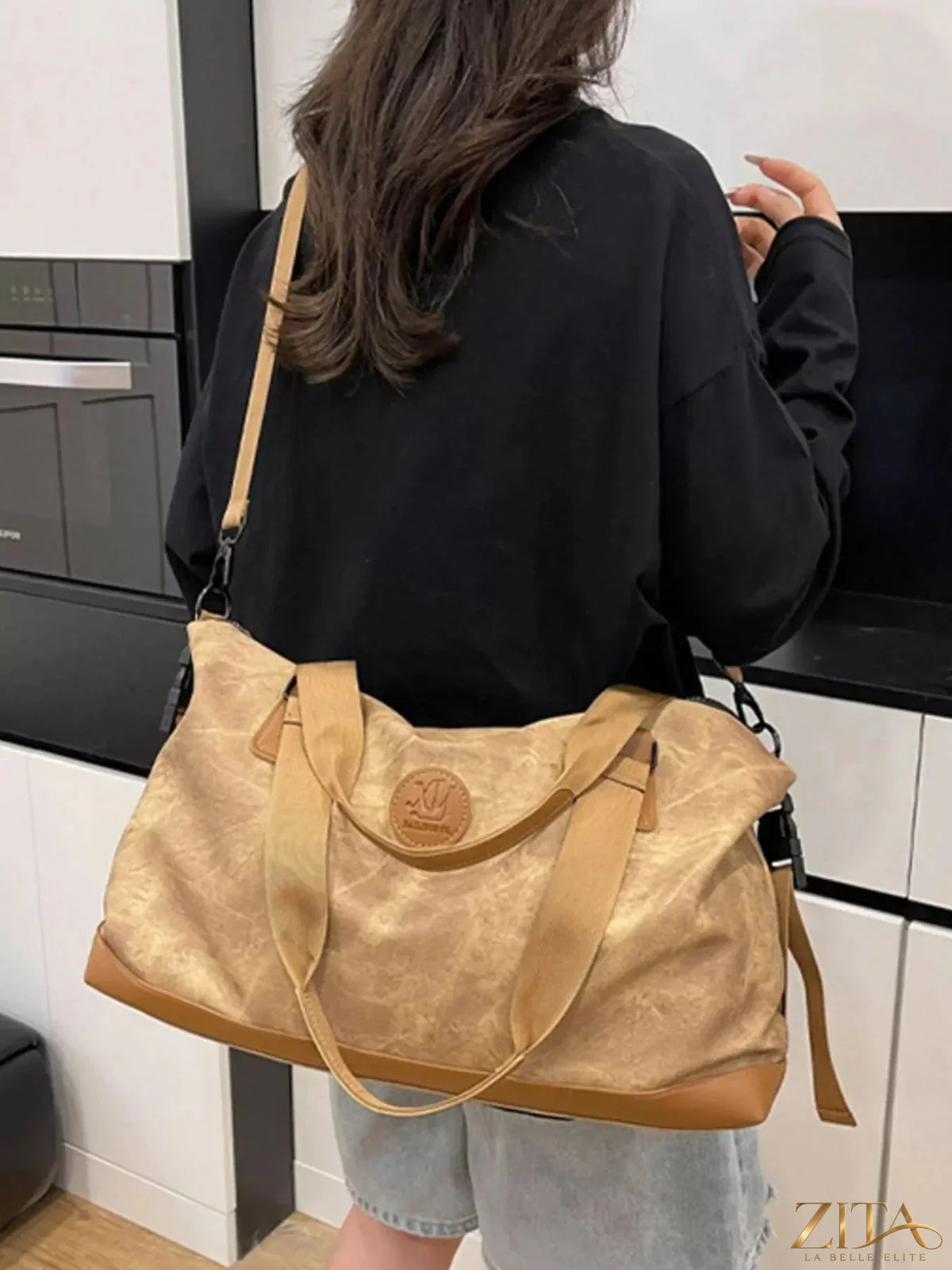 Vintage Oxford cloth duffel bag by Zita La Belle Elite, showing the durable bag with leather accents and spacious interior.