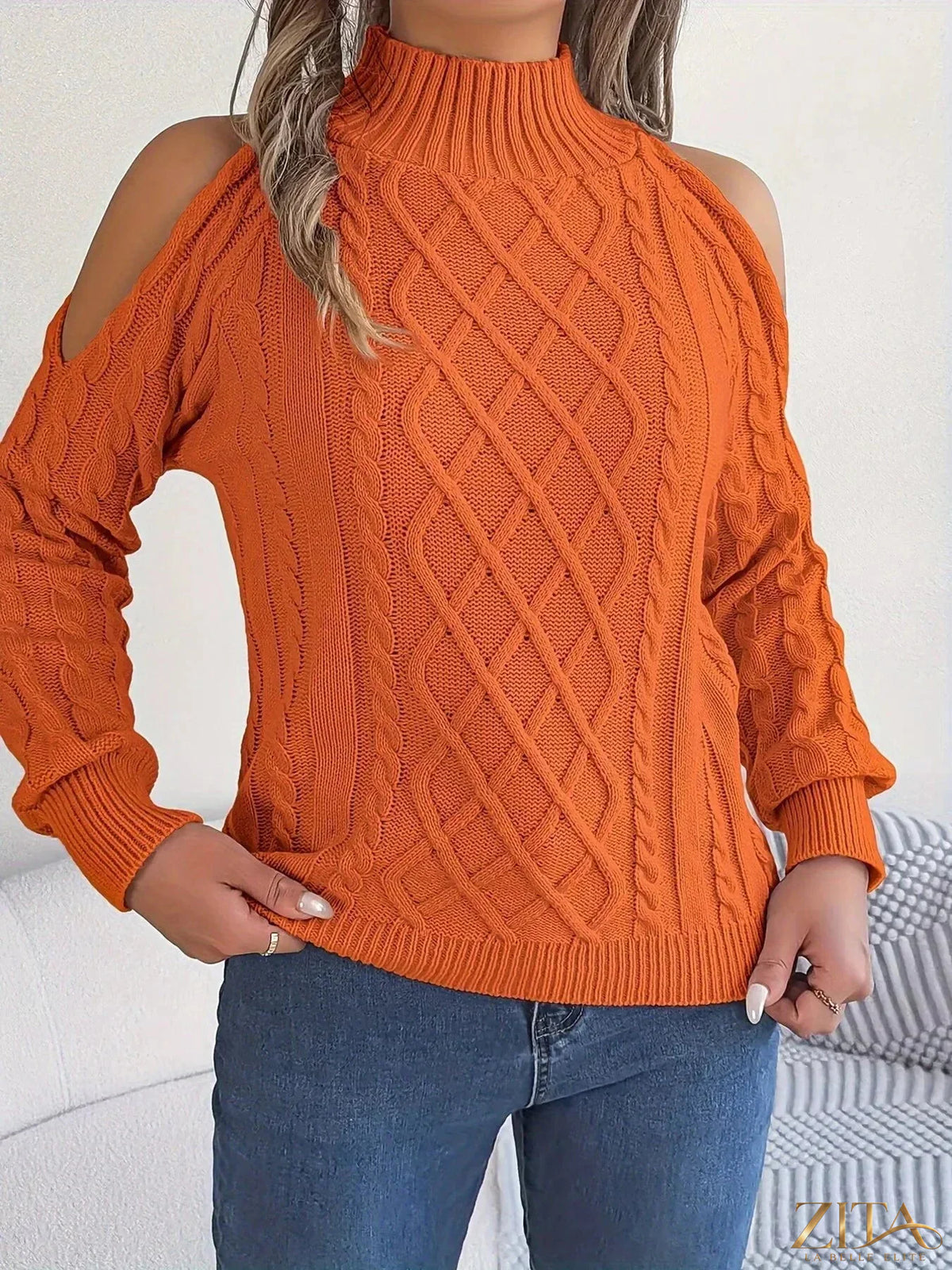 Zita La Belle Elite cold-shoulder cable knit sweater with long sleeves, featuring a cozy textured design and stylish cutouts.