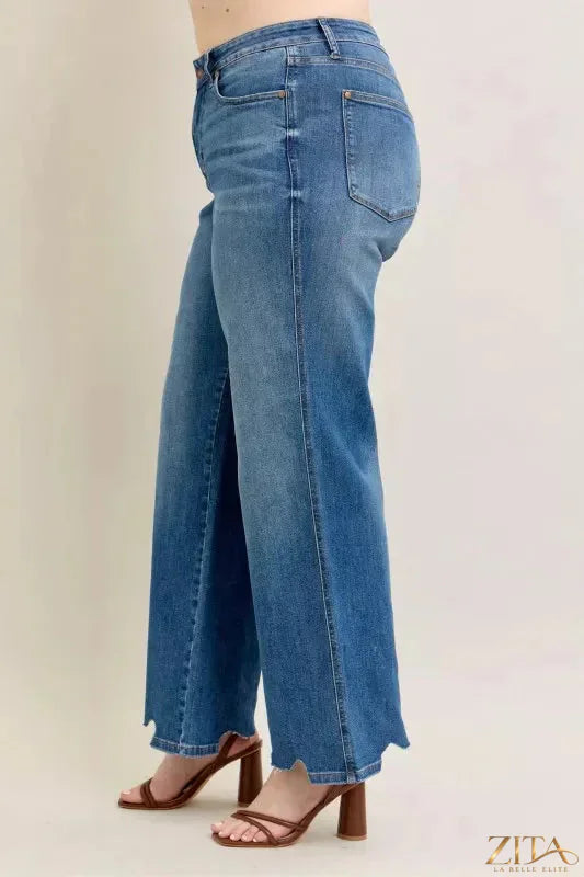 Zita La Belle Elite Judy Blue tummy control distressed wide jeans with frayed hems and fit details, showcased on a model.