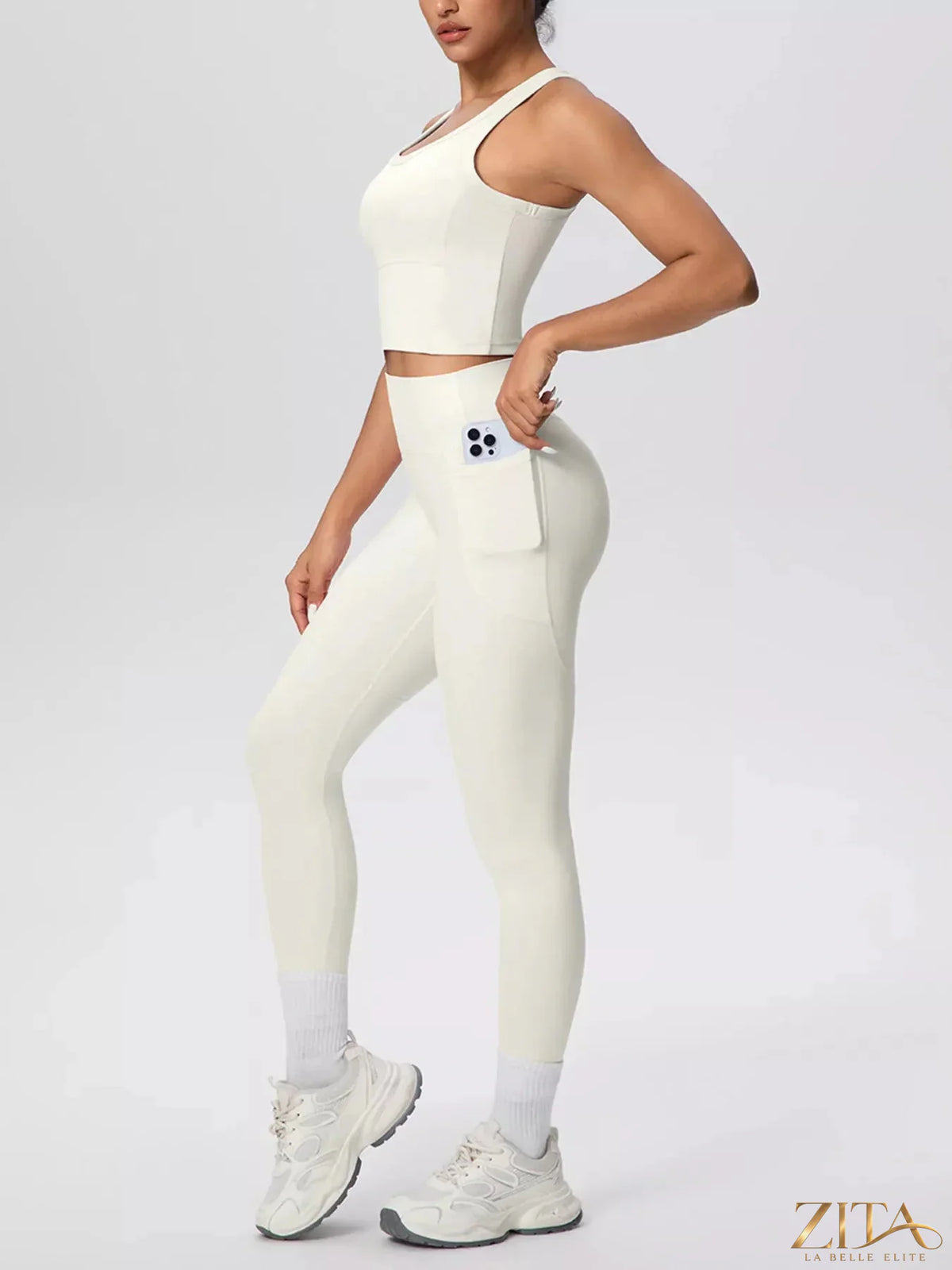 Zita La Belle Elite scoop neck tank and high-waisted leggings active set, shown on a model in a fitness pose.