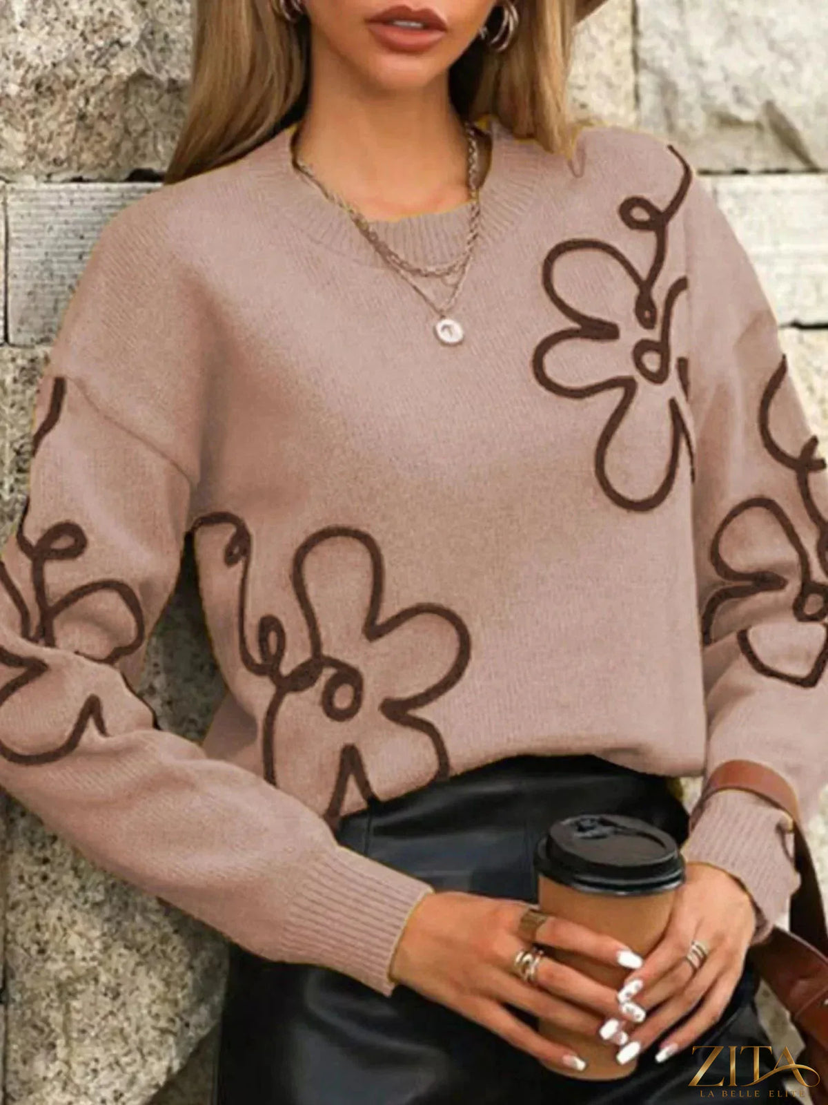 Flower dropped shoulder sweater by Trendsi featuring a floral pattern, relaxed fit, and dropped shoulder design in soft knit fabric.