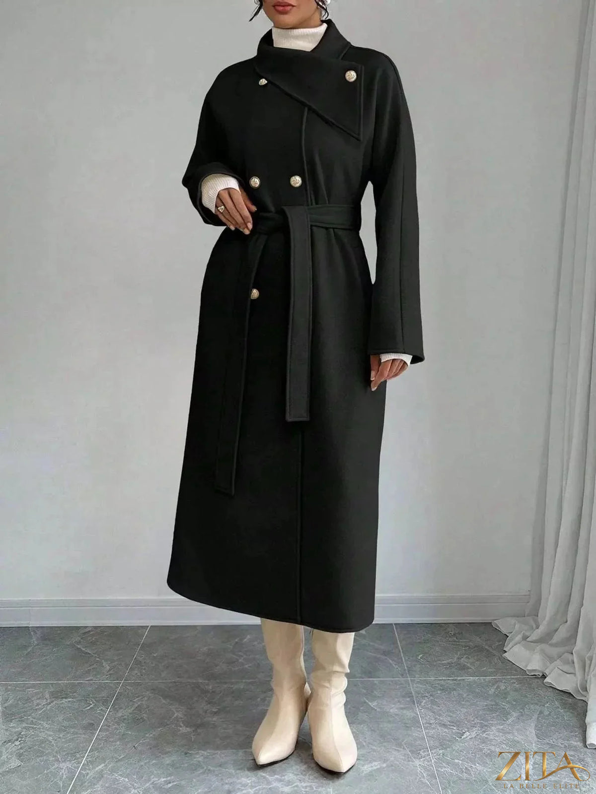 Zita La Belle Elite double-breasted longline coat shown on a model, featuring a tailored fit and classic design in neutral fabric.