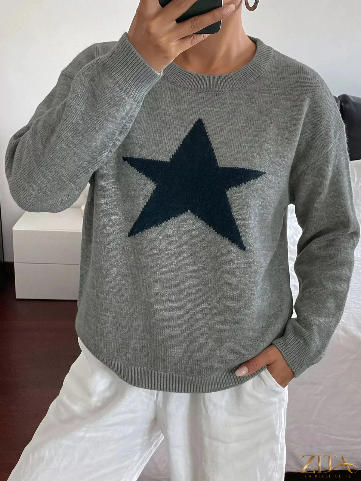 Star-patterned dropped shoulder sweater by Zita La Belle Elite, featuring a cozy knit with star designs on a soft fabric.
