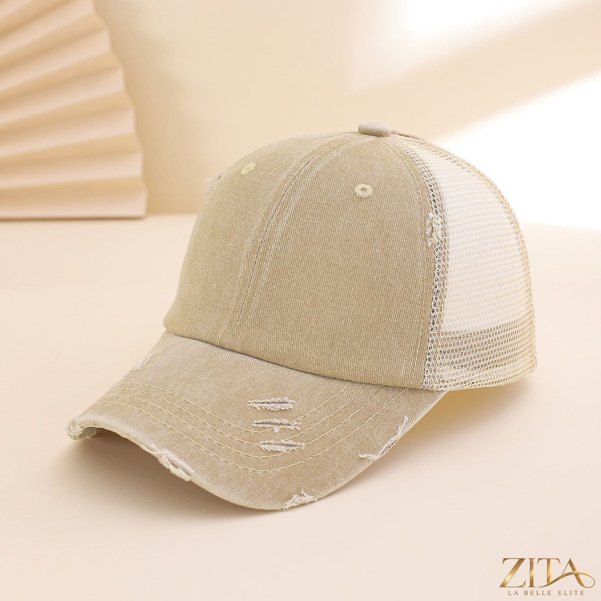 Distressed washed mesh baseball cap by Zita La Belle Elite, featuring a casual, worn-in look with breathable mesh panels.