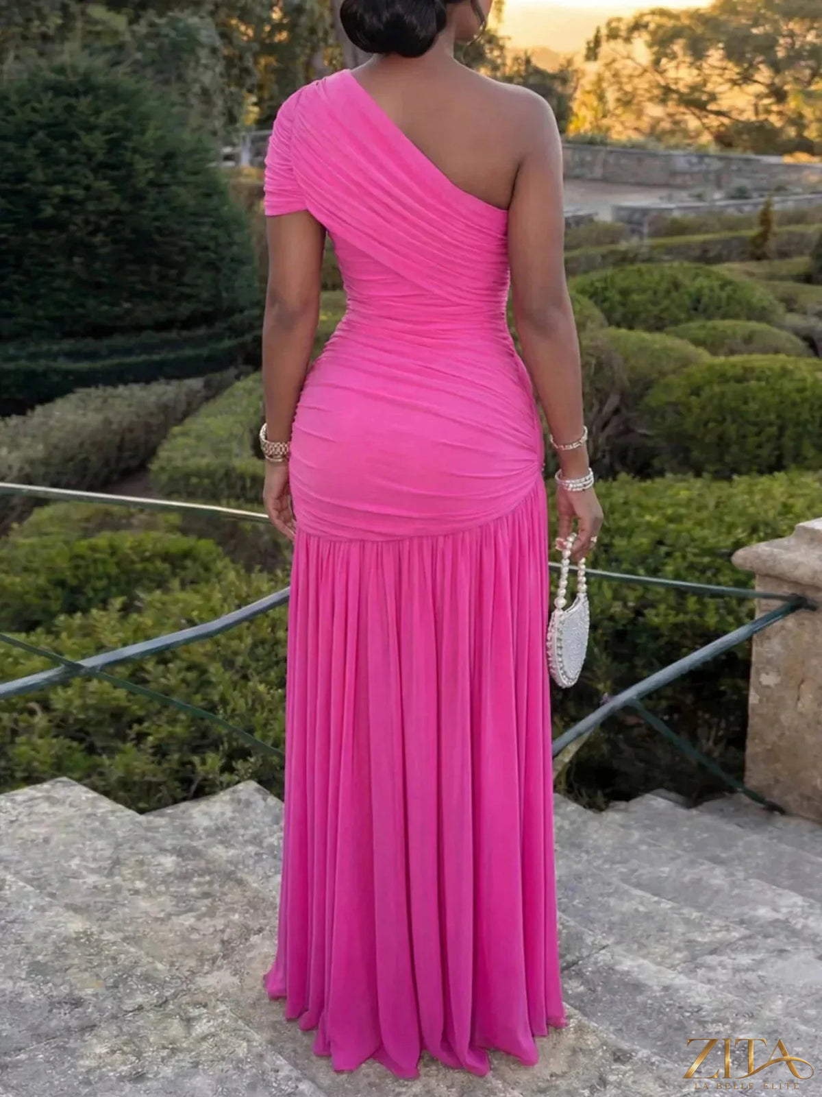 Zita La Belle Elite one-shoulder ruched high-slit evening dress featuring elegant draping and a thigh-high slit on a black fabric.