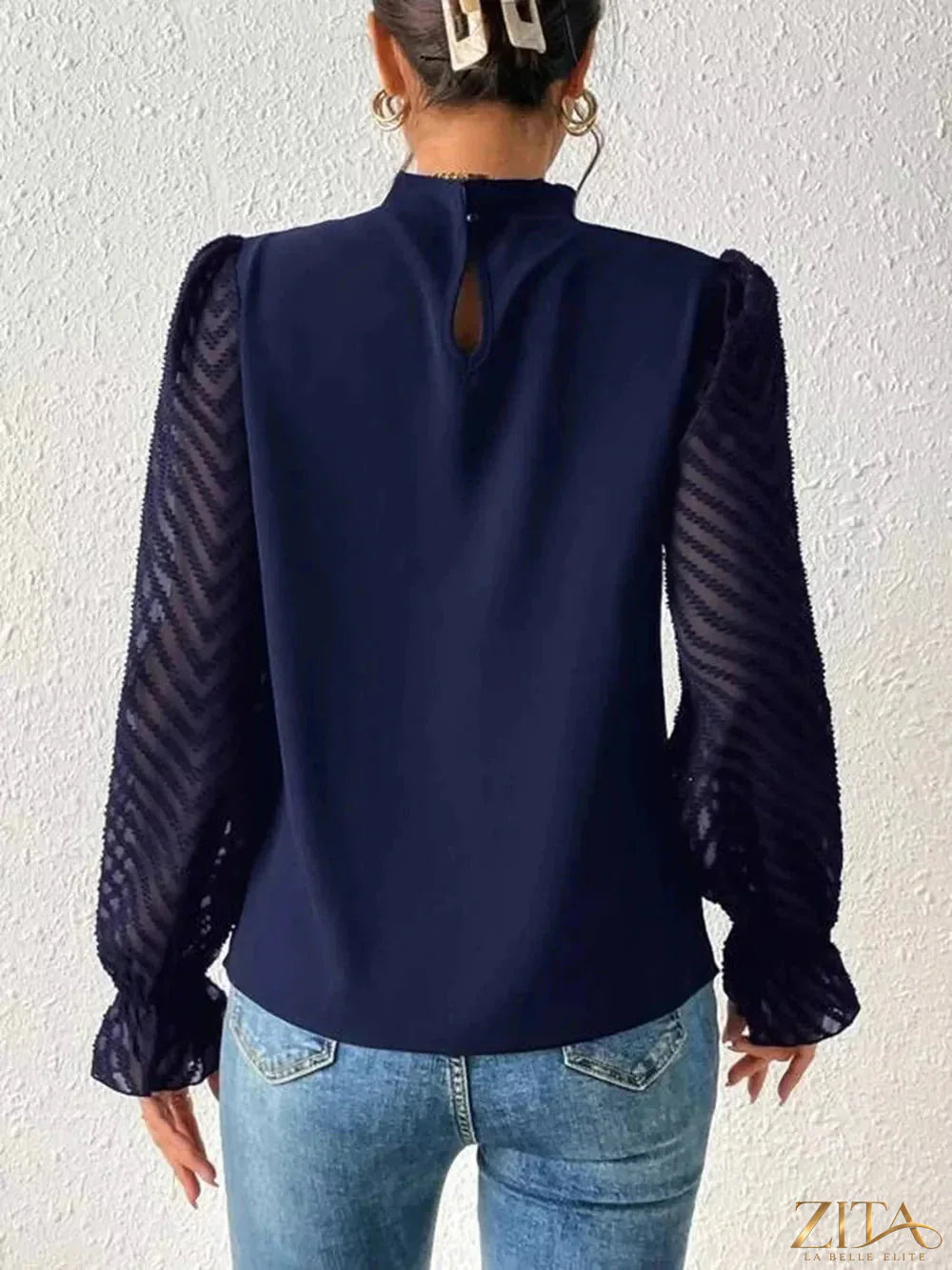 Zita La Belle Elite mock neck blouse with flounce sleeves, featuring a stylish and elegant design in soft fabric.