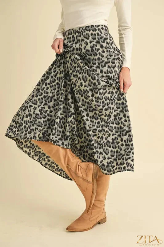Leopard print midi skirt from Aemi+Co featuring a flowing silhouette and trendy animal pattern, perfect for stylish everyday wear.