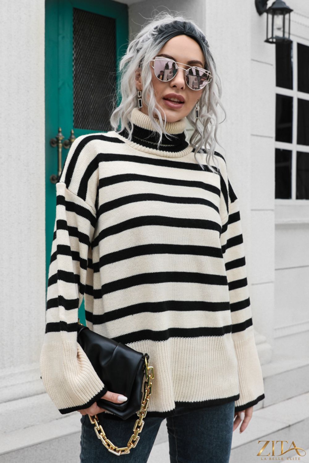 Striped turtleneck drop shoulder sweater by Trendsi, featuring a cozy fit with bold stripe patterns and a high neckline.