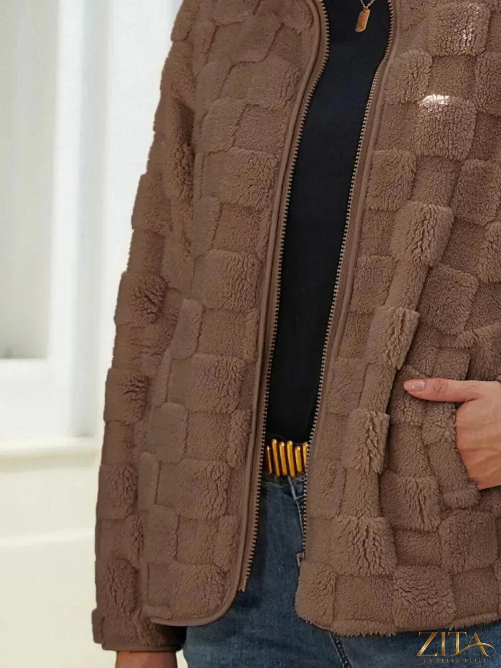 Zita La Belle Elite fuzzy checkered zip-up jacket with a cozy, stylish design and front zipper closure.