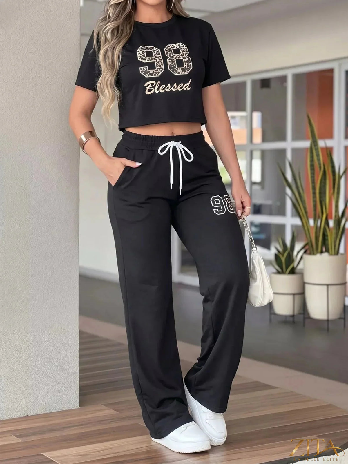 Zita La Belle Elite leopard print crop top and wide-leg pants set, stylish fashion ensemble with bold animal pattern.