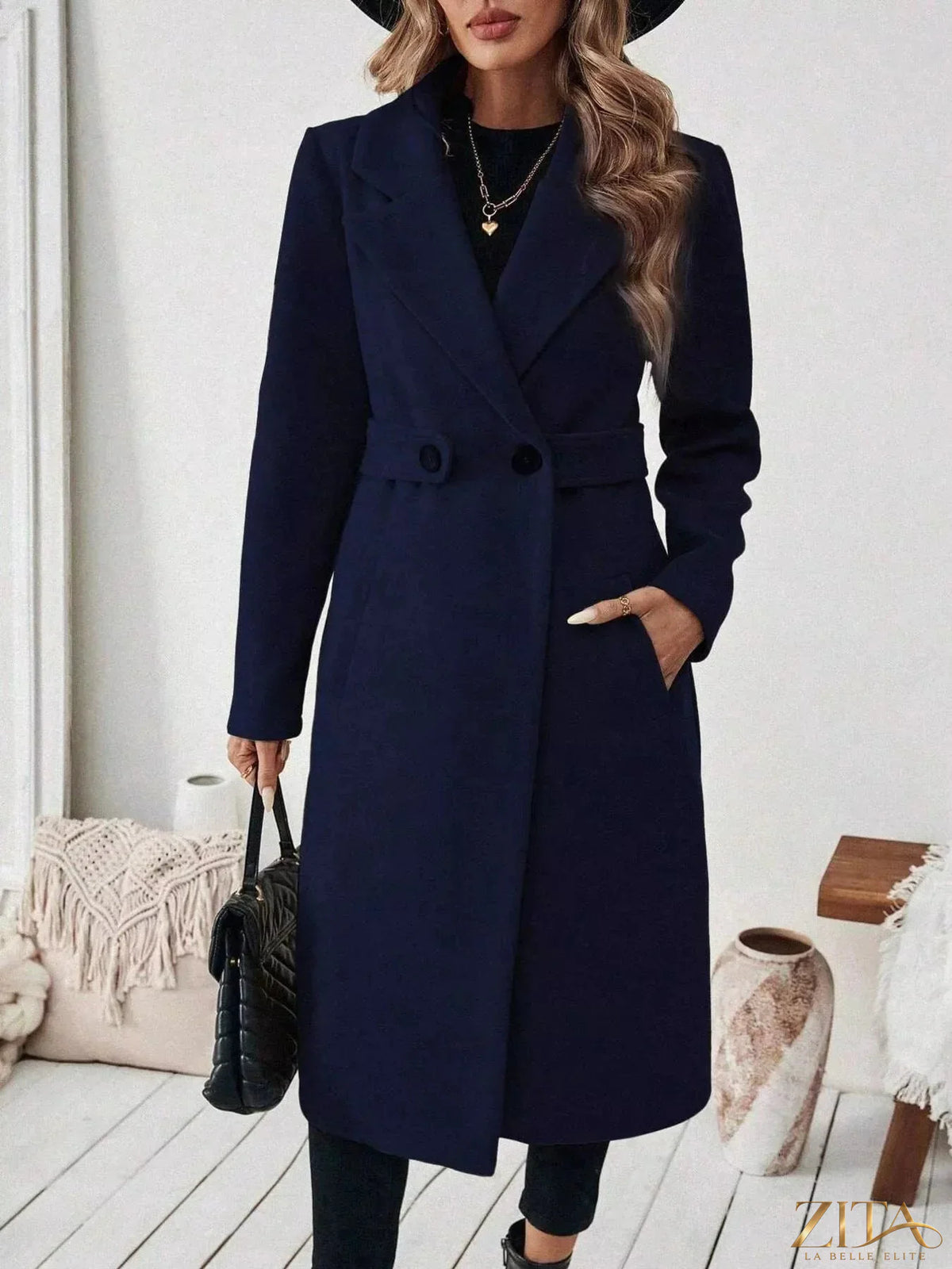 Zita La Belle Elite single-button longline coat in neutral fabric, displayed on a hanger against a plain background.