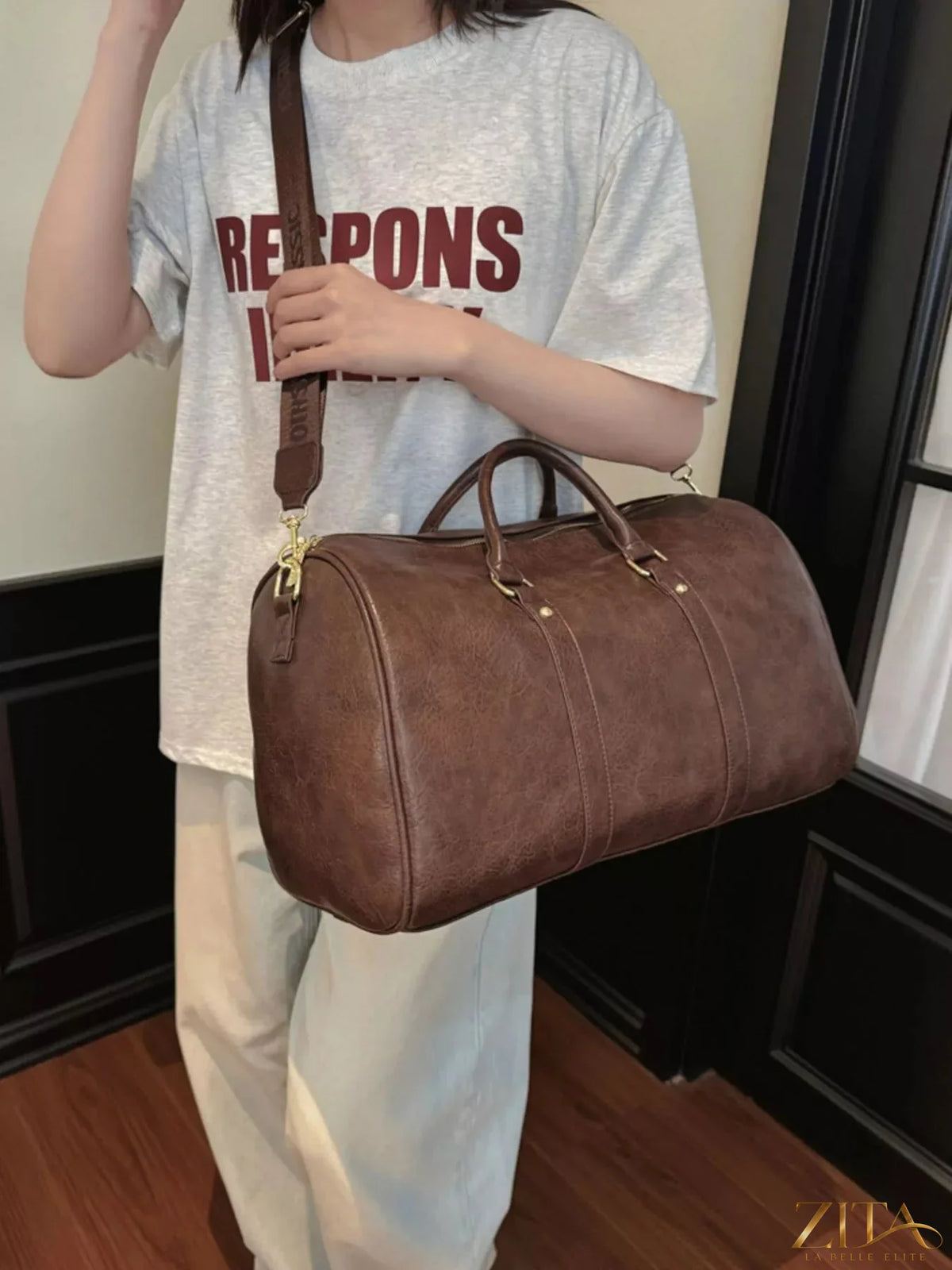 Trendsi PU leather travel bag with sturdy handles, spacious main compartment, and sleek design for stylish travel accessories.