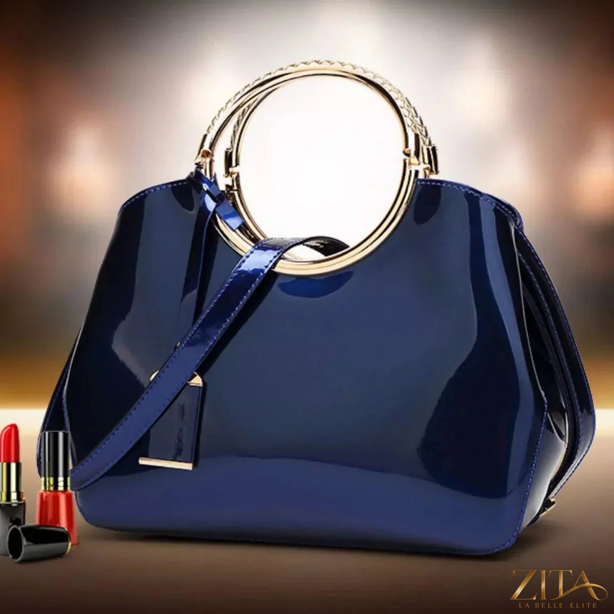 Glossy Zita La Belle Elite ring handle handbag with smooth finish and stylish design, featuring a prominent circular handle and elegant silhouette.