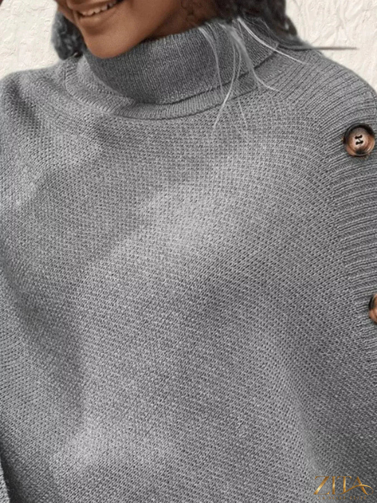 Zita La Belle Elite button-decor turtleneck poncho pullover in cozy knit fabric with decorative buttons and a relaxed fit.