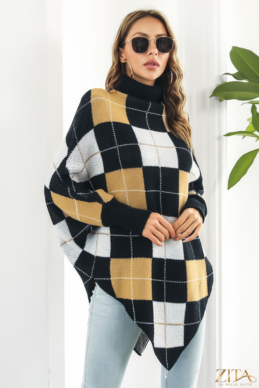 Plaid turtleneck dolman sleeve poncho in cozy fabric, featuring a stylish plaid pattern and relaxed fit for casual wear.