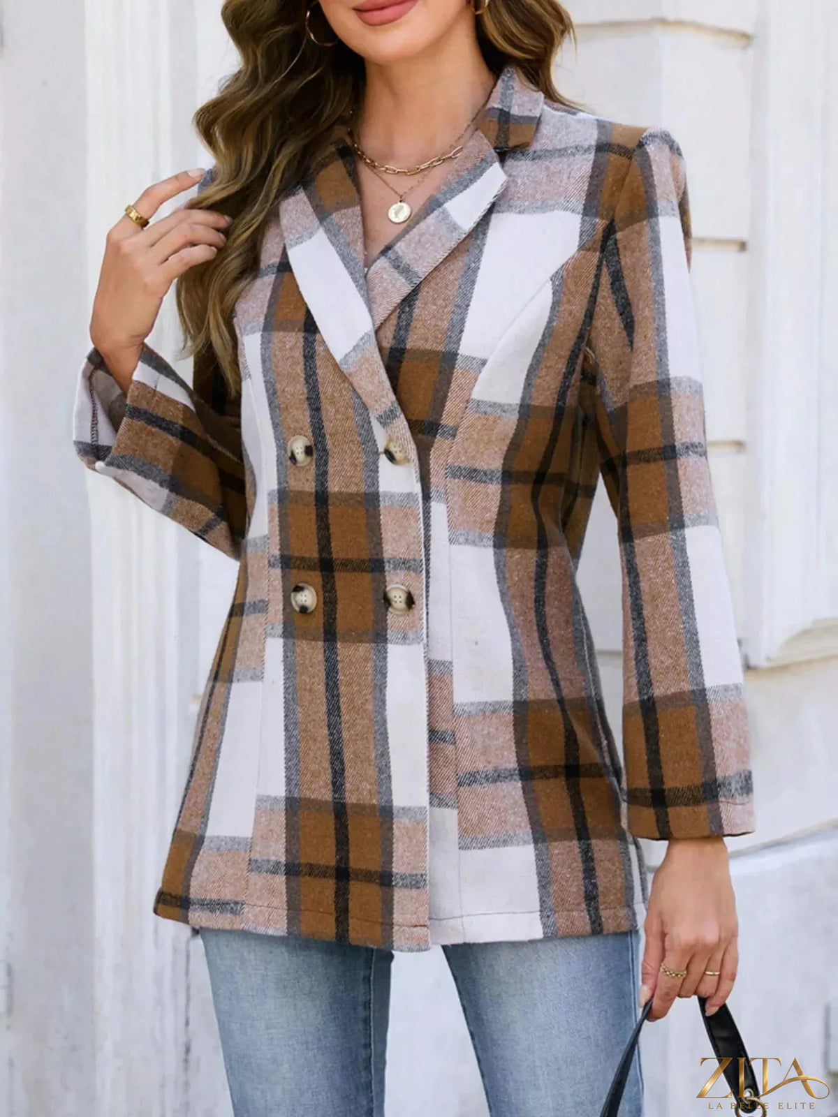 Plaid double-breasted blazer from Trendsi featuring a tailored fit, classic lapels, and front button closure in a stylish pattern.