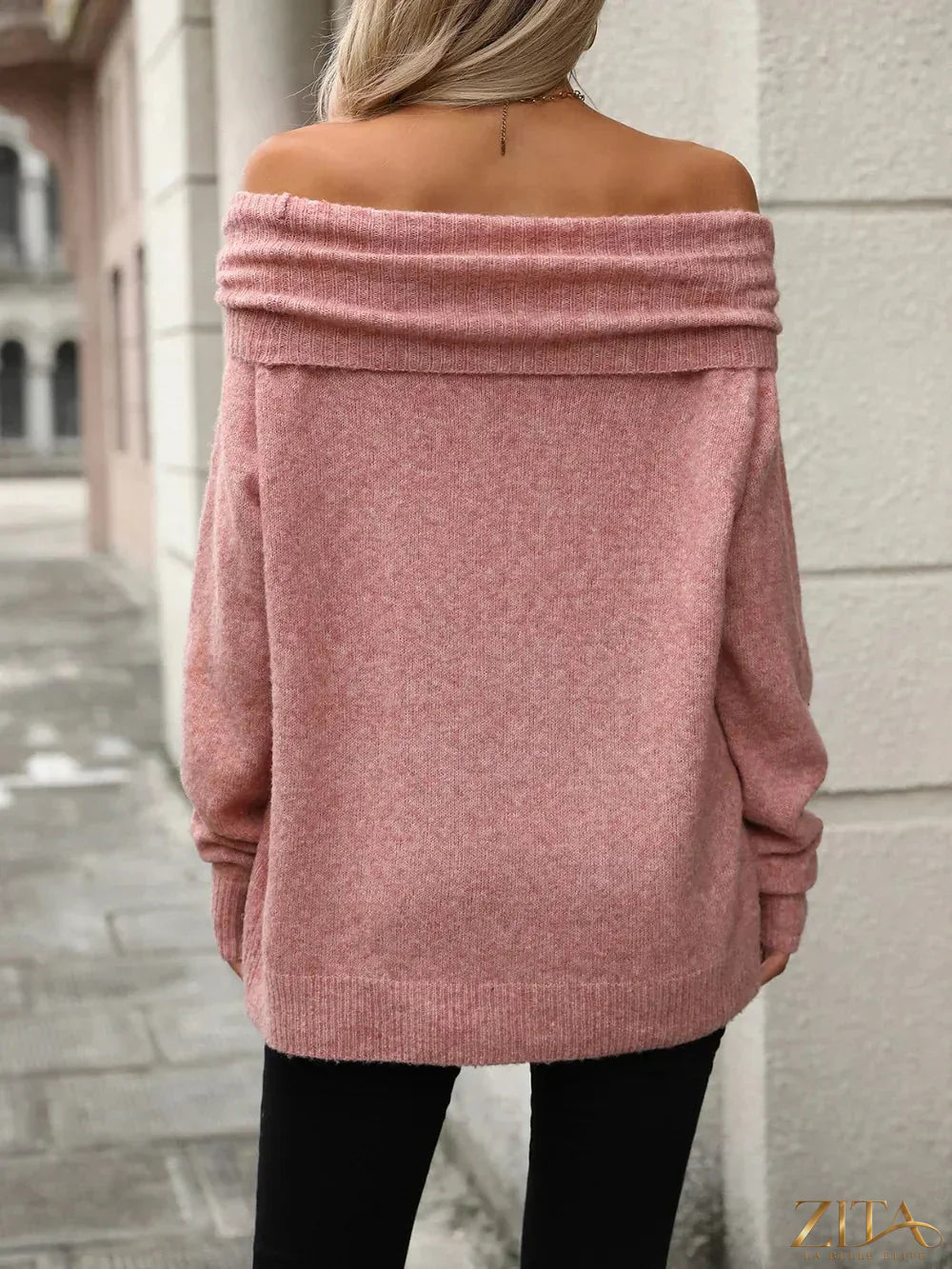 Long sleeve turtleneck sweater from Trendsi, soft knit fabric, fitted style, in a neutral color, displayed on a hanger.