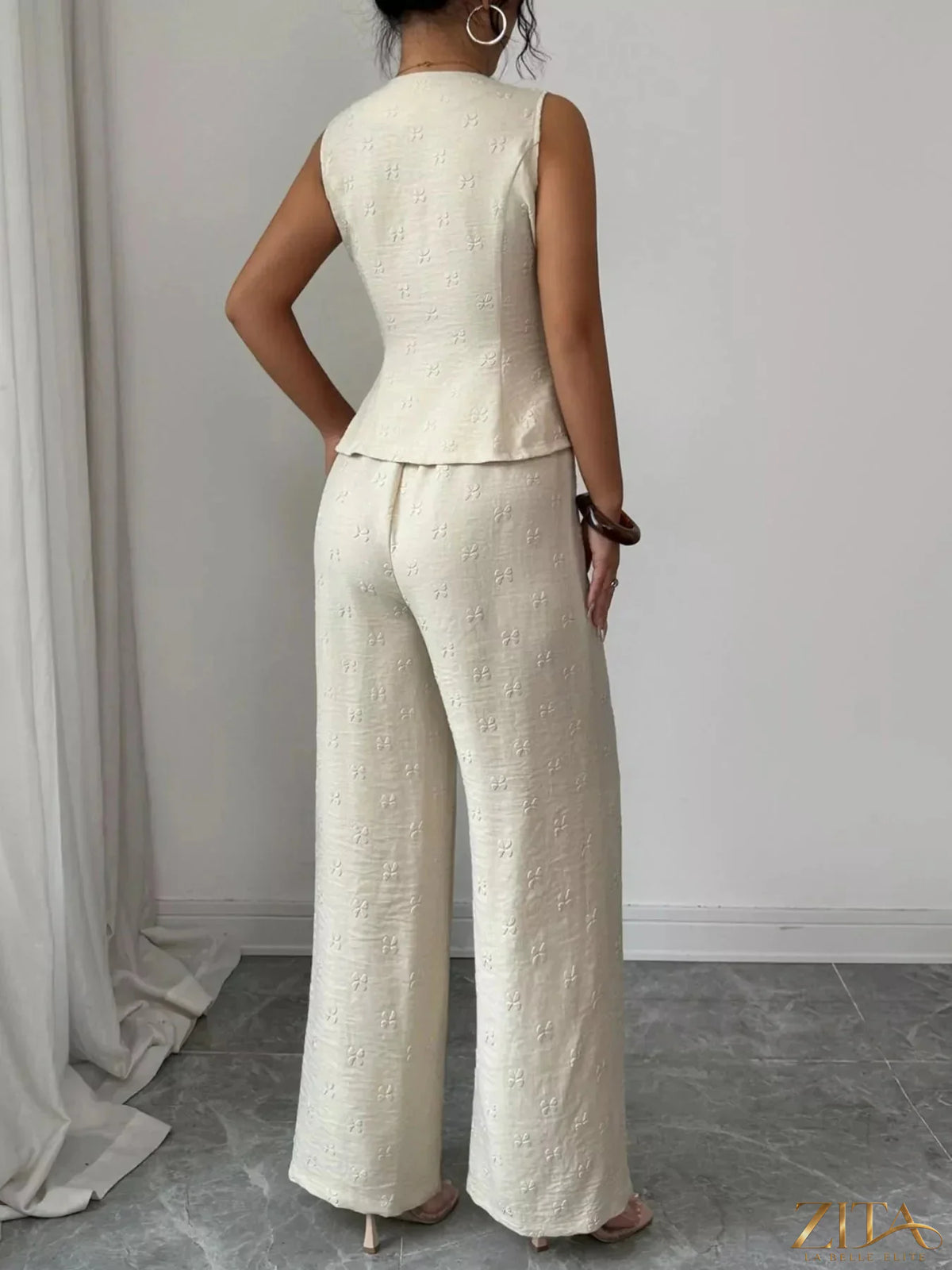 Zita La Belle Elite sleeveless peplum top and wide-leg pants set, stylish and elegant outfit for women.