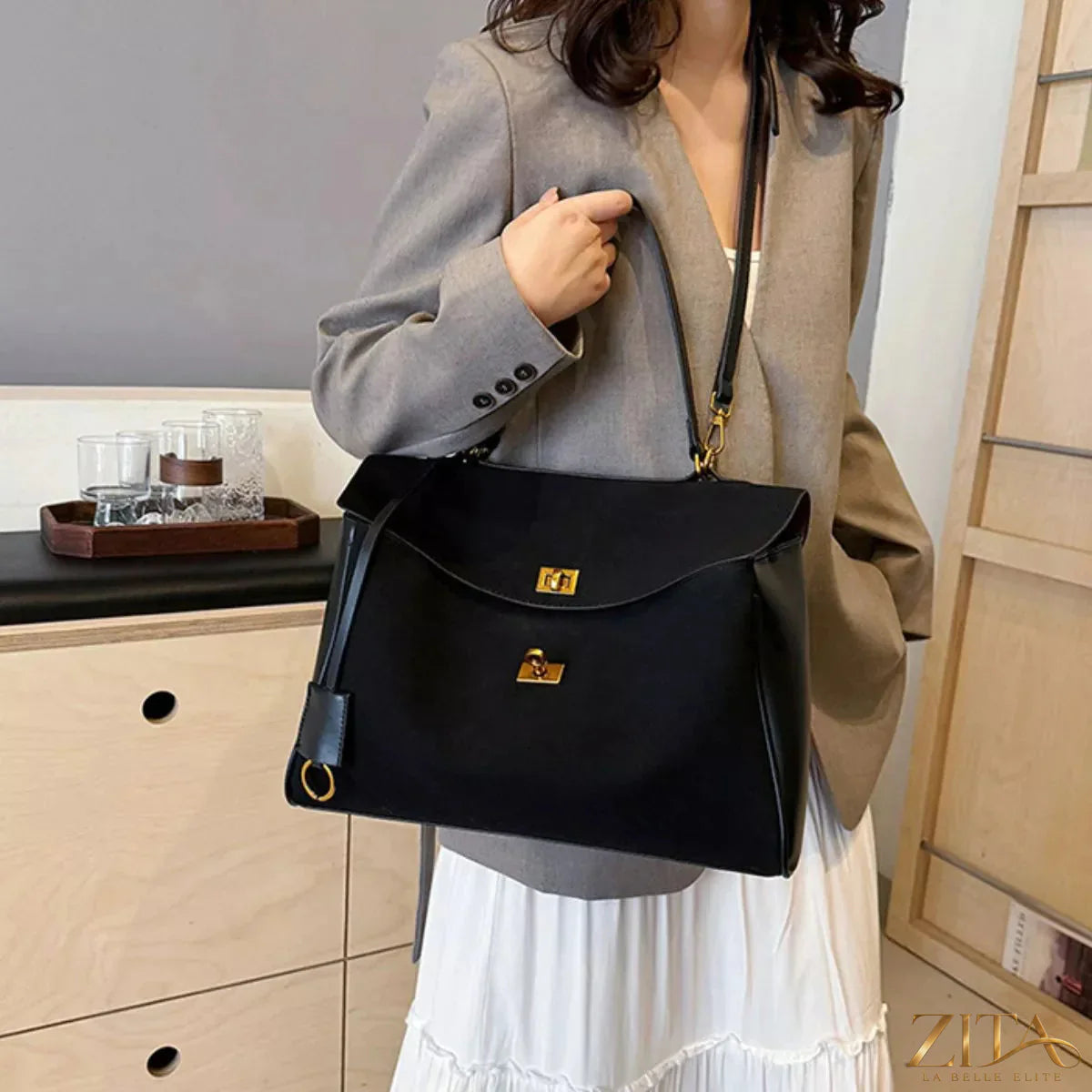 Trendsi PU leather shoulder bag with adjustable strap, featuring sleek design and spacious interior for everyday use.