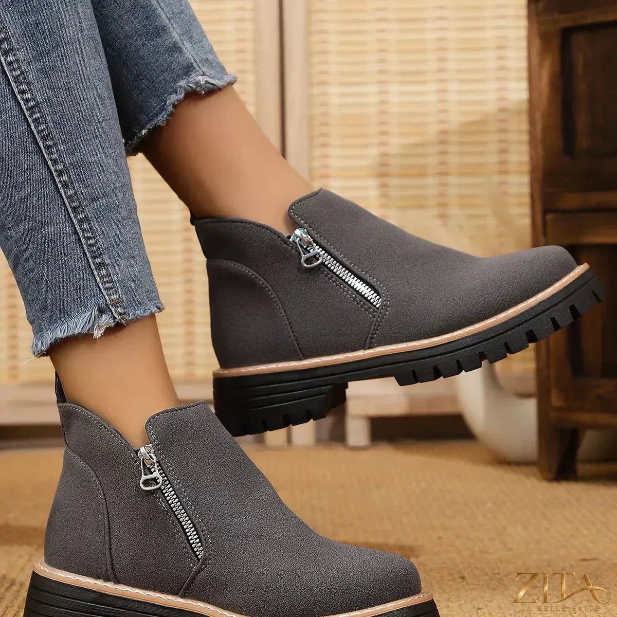 Zita La Belle Elite ankle boots with zipper accent, featuring black leather and stylish design, on a plain background.