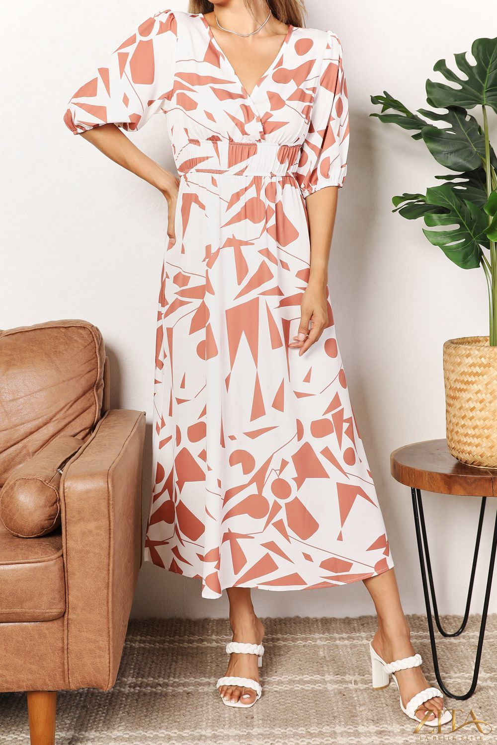 Printed surplice balloon sleeve dress by Zita La Belle Elite, featuring a stylish wrap design and voluminous balloon sleeves.