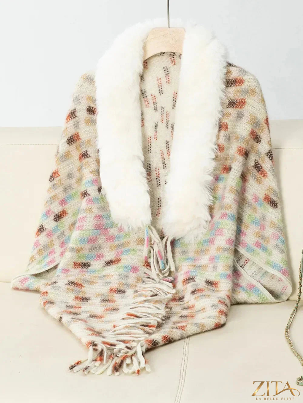 Fuzzy open front poncho with fringe details in neutral tones, stylish and cozy, by Trendsi.