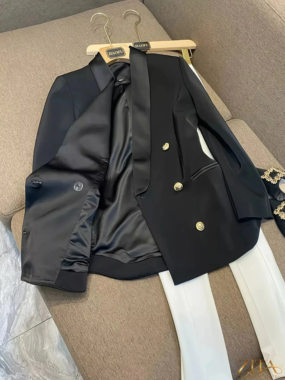 Slim fit double-breasted blazer from Trendsi with structured shoulders and classic lapel, shown in a stylish dark fabric.