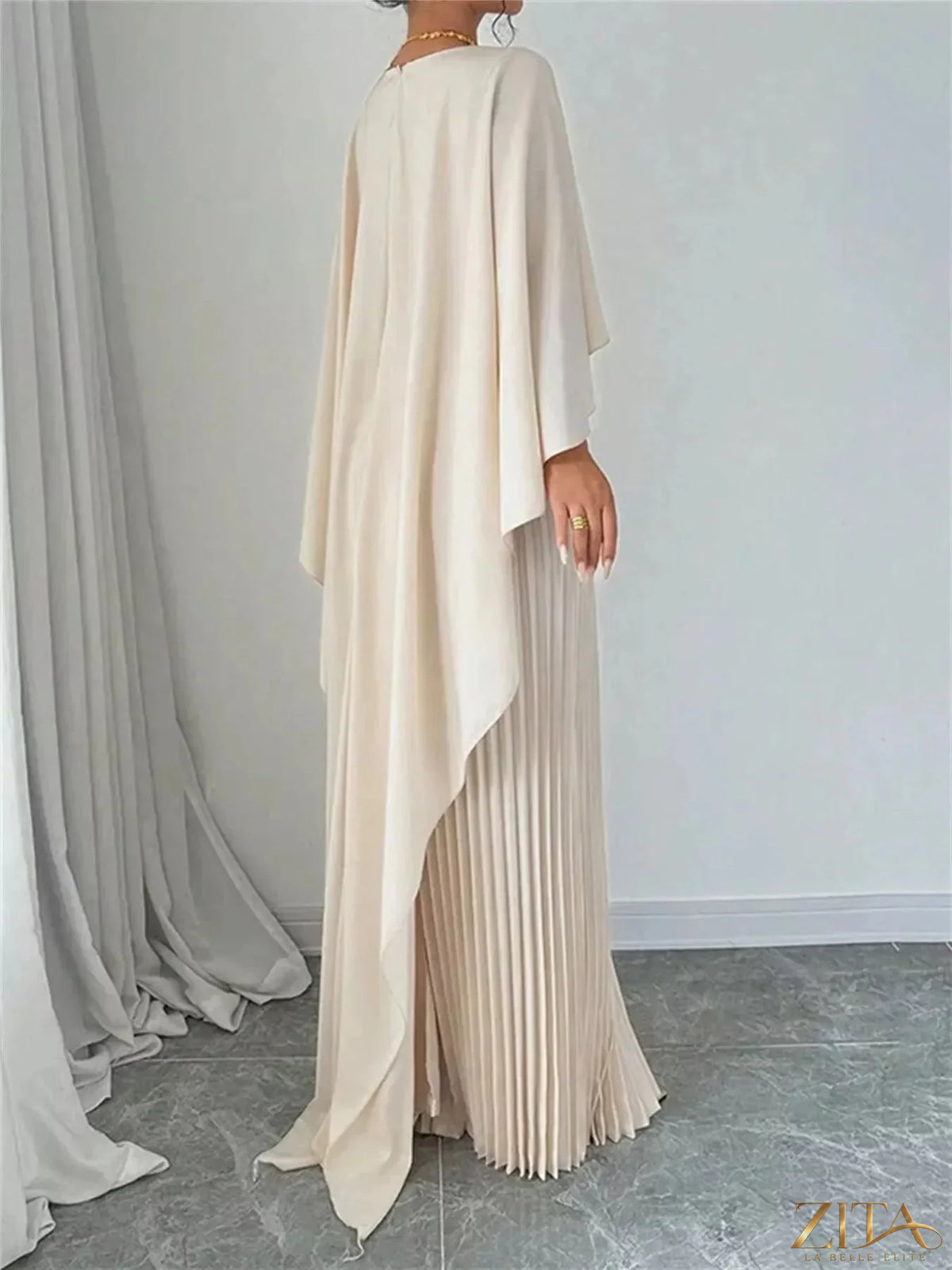 Elegant navy blue cape pleated maxi dress by Trendsi featuring flowing fabric and a stylish, sophisticated design.