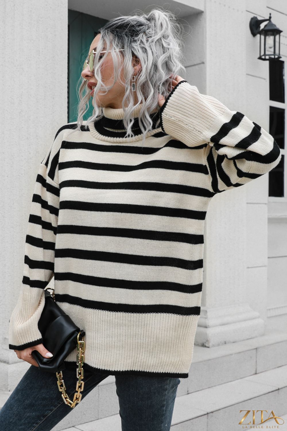 Striped turtleneck drop shoulder sweater by Trendsi, featuring bold horizontal stripes and a cozy, relaxed fit.