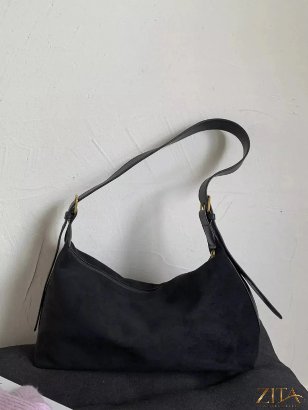 Zita La Belle Elite solid color suede hobo crossbody bag with minimalist design and shoulder strap.