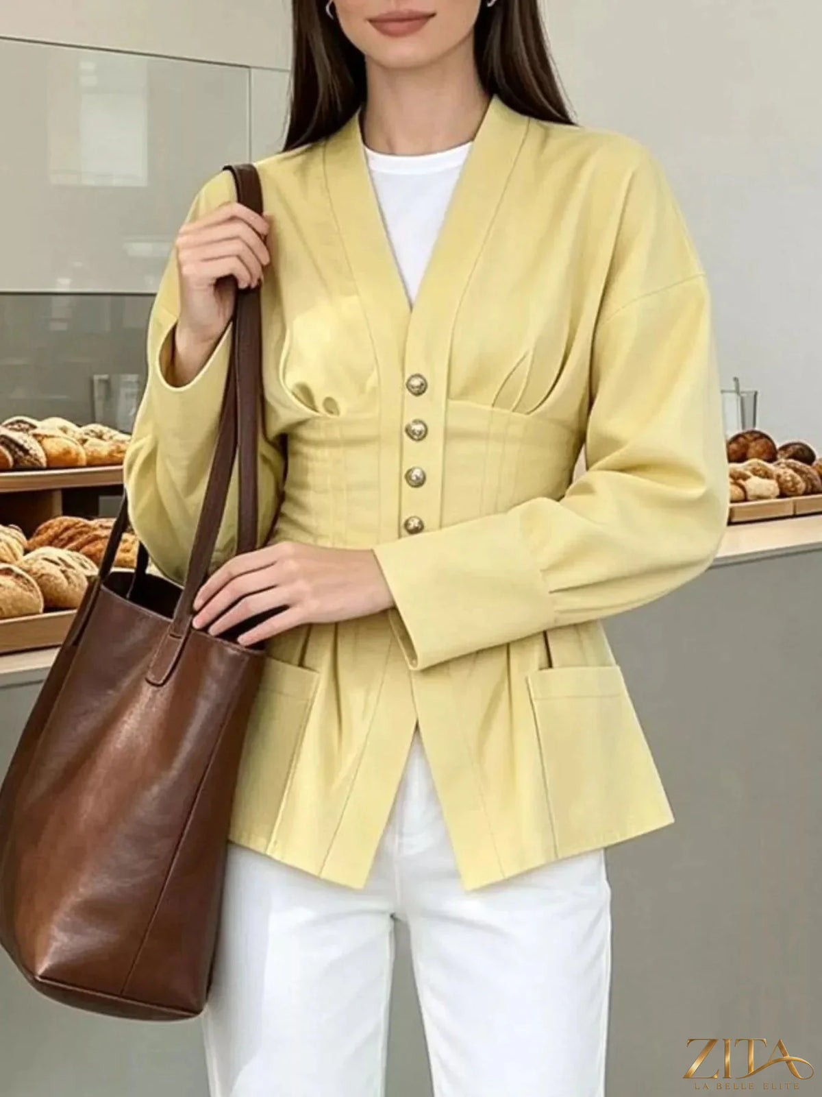 Zita La Belle Elite pleated waist blouse with button detail, shown in a stylish and elegant design.