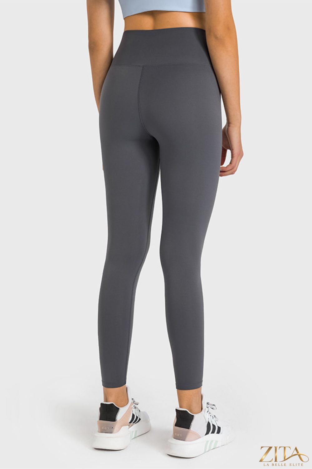 Zita La Belle Elite Millennia high waist ankle-length yoga leggings in black, shown on a model with a close-up view of the fabric.