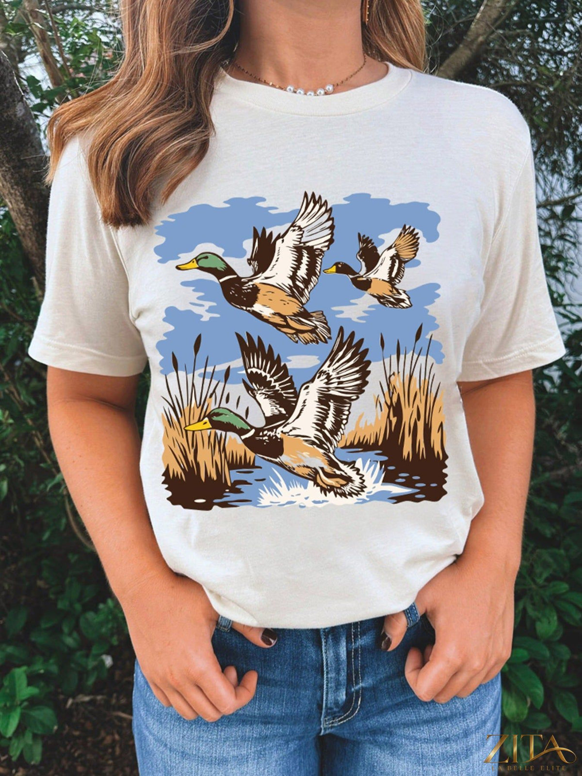 Wild Duck graphic round neck T-shirt by Trendsi featuring a colorful duck design on soft cotton fabric.
