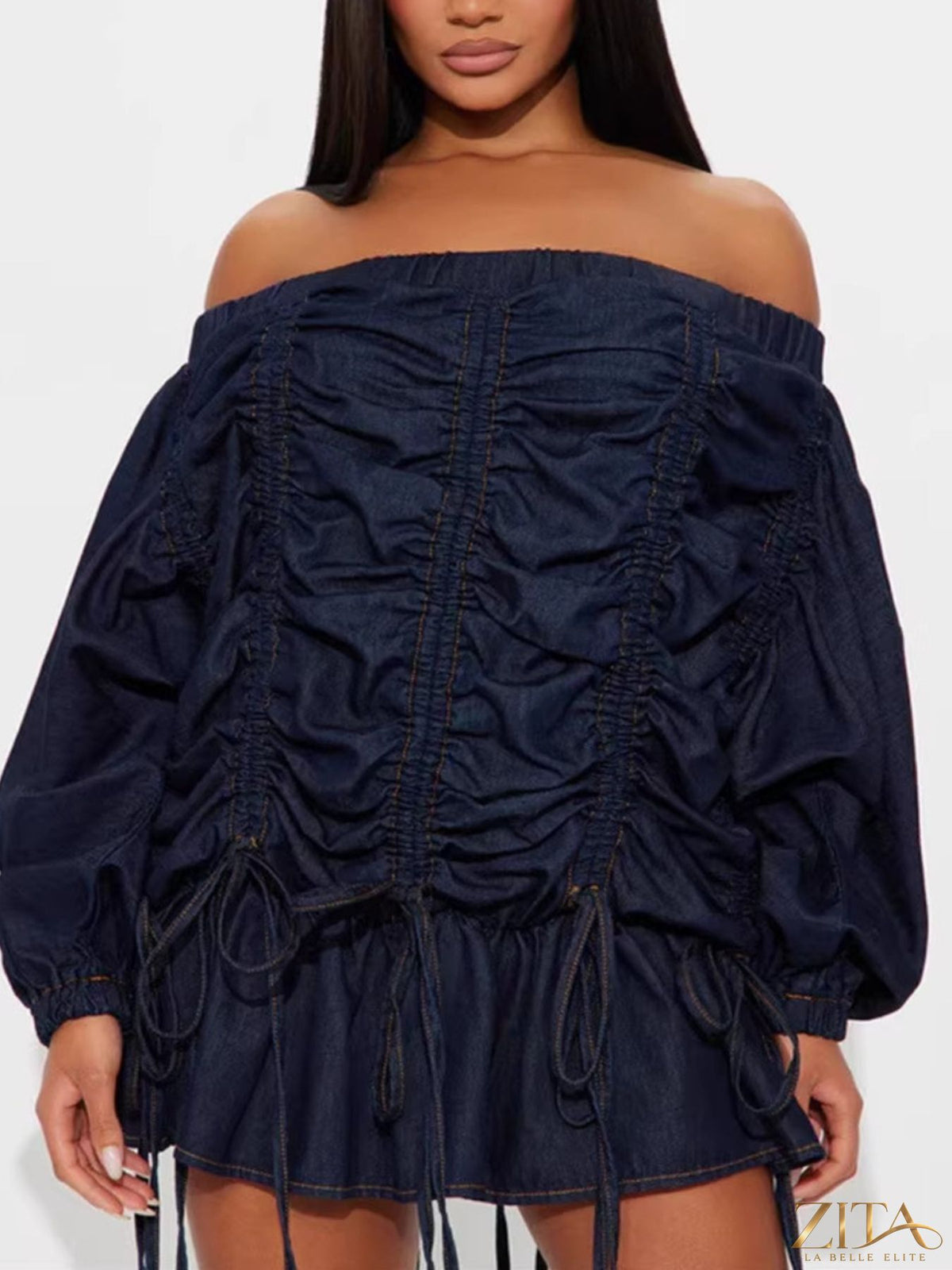 Off-shoulder ruched denim dress by Trendsi featuring a fitted design, long sleeves, and trendy casual style.