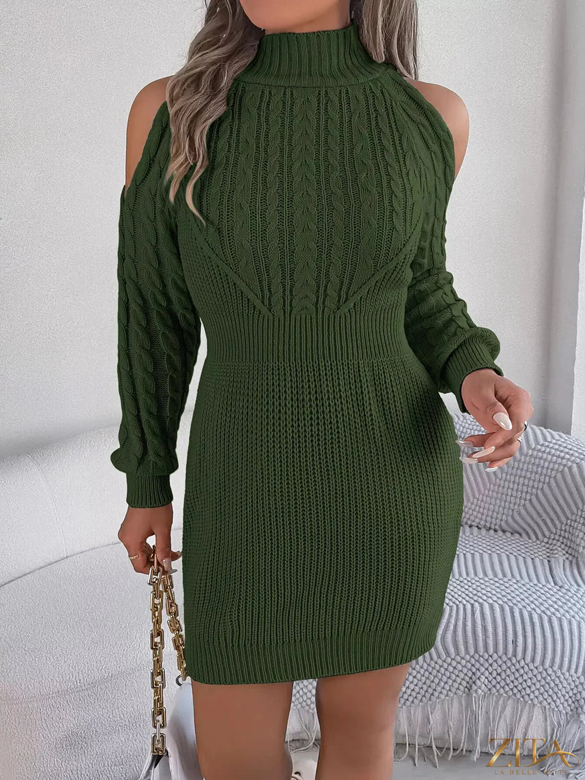 Cold shoulder cable knit turtleneck sweater dress by Trendsi, featuring a cozy knit design with shoulder cutouts and a high neckline.